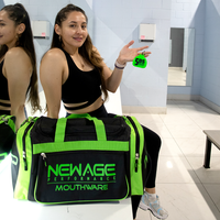 Thumbnail for Girl sitting on the counter in the gym locker room holding a green 5DS mouthpiece and showing off the deluxe gym bag