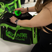 Girl placing her green 5DS mouthpiece case inside her deluxe gym bag