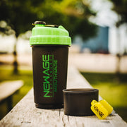 Shaker cup on a picnic table with a blurry background